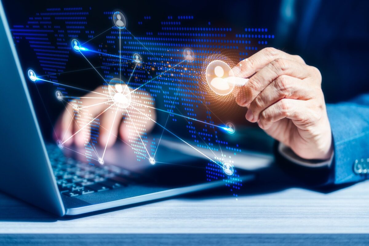 Businessman using computer laptop to connect scaled e1658386739658